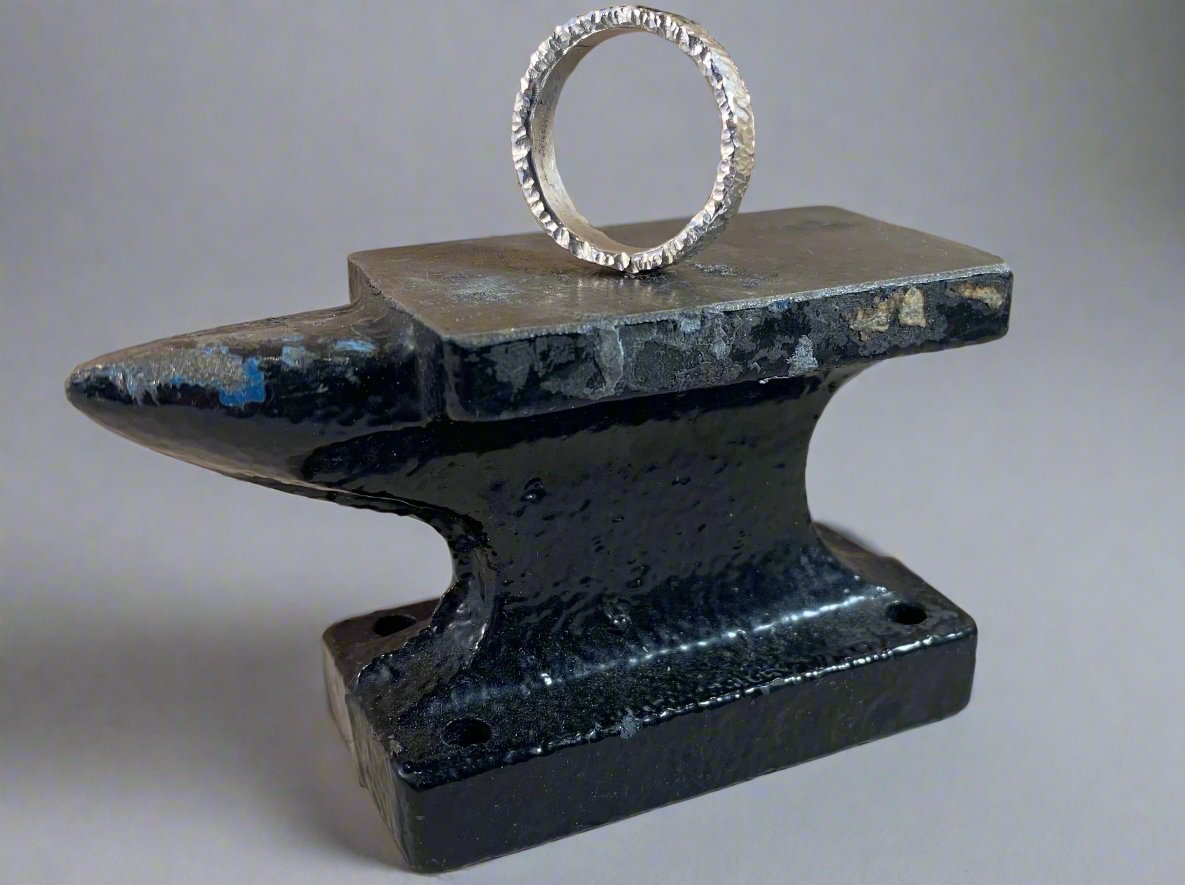 Side angle of hammered ring on an anvil