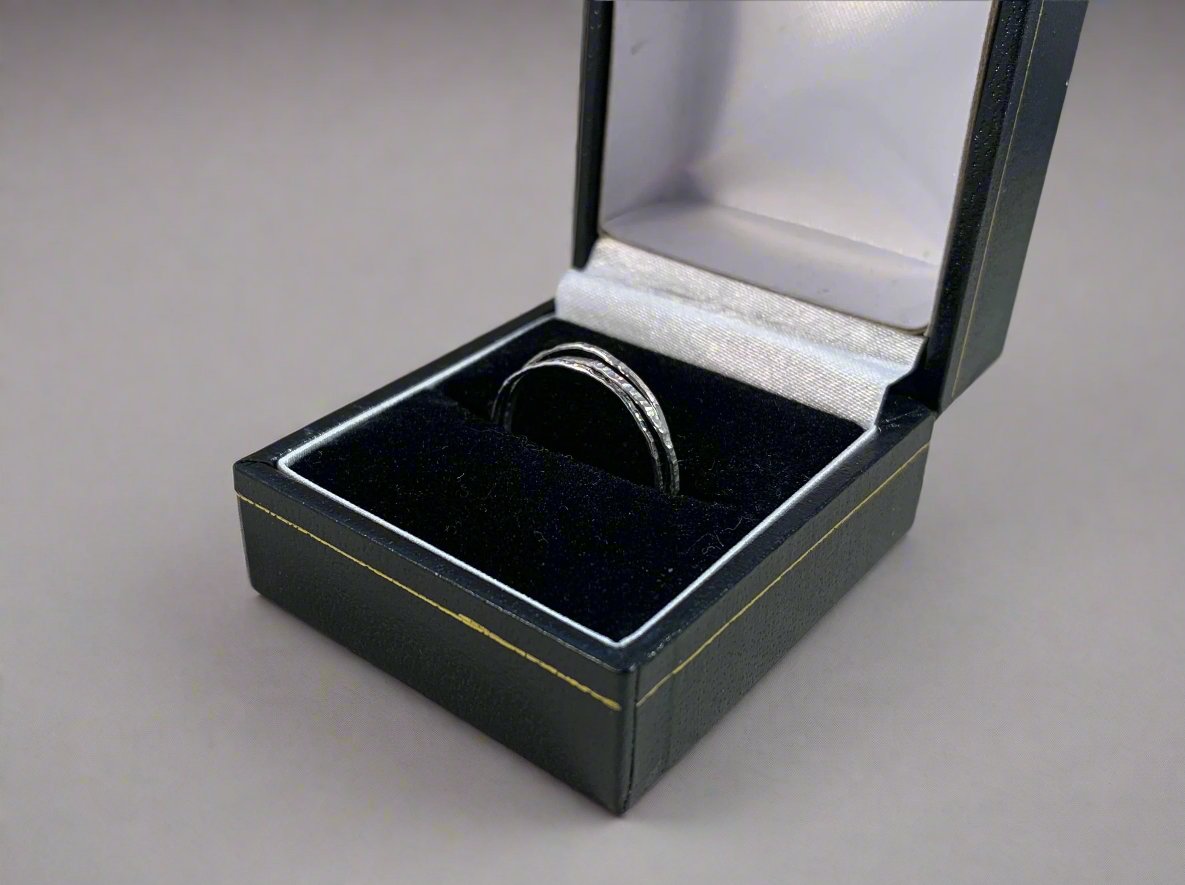 Hammered stacking rings in a ring box right side 