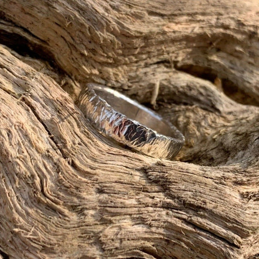 Front angle of hammered ring on log